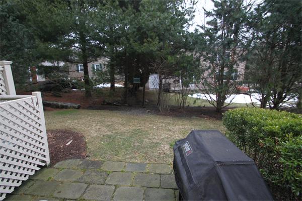 49 Intrepid Circle, Unit 49 Marblehead, MA 01945 - Photo 12 of 12 a backyard of a house with lots of green space
