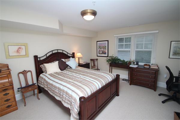 49 Intrepid Circle, Unit 49 Marblehead, MA 01945 - Photo 7 of 12 a bedroom with bed chair and window