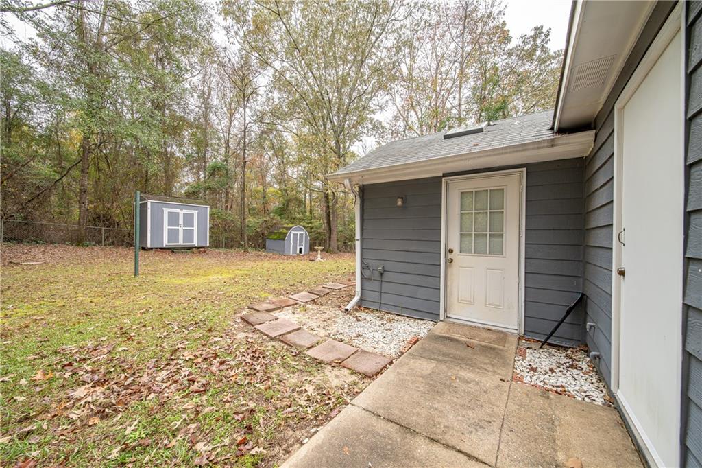 143 Lee Road 979 Phenix City, AL 36870 - Photo 9 of 37 View of yard with a storage shed