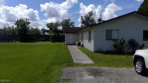 13447 First Street, Unit 449 Fort Myers, FL 33905 - Photo 1 of 1 a view of a house with backyard and garden