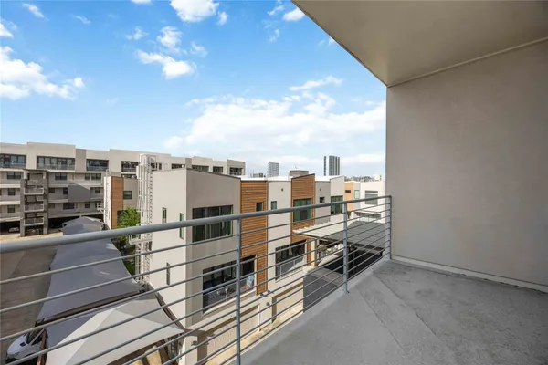 a view of a balcony with city view