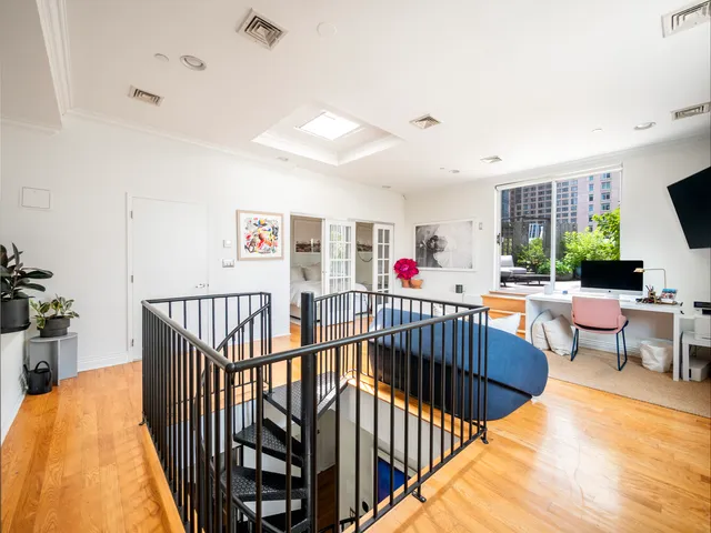 a large white bed in a white house