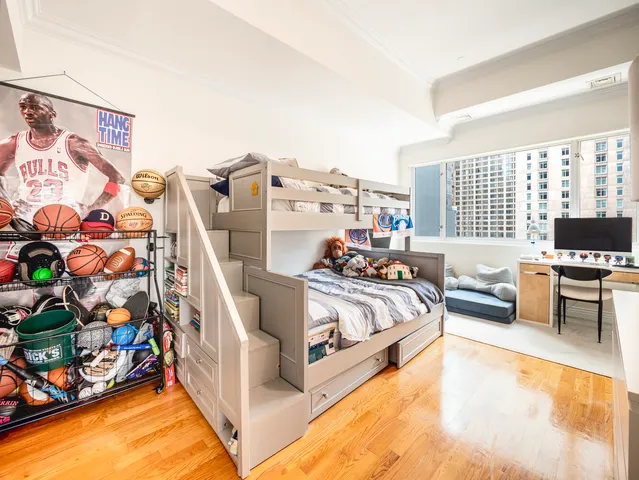 a bed room with bed and a window