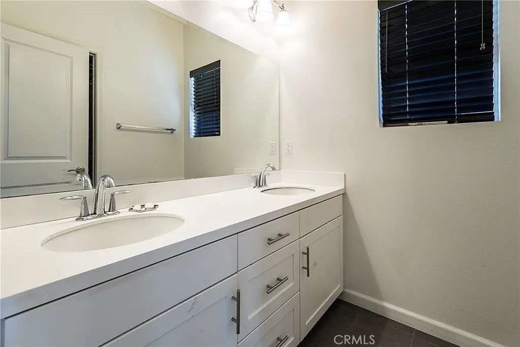 11811 Cramer Road Yucaipa, CA 92399 - Photo 24 of 56 a bathroom with a sink and a mirror