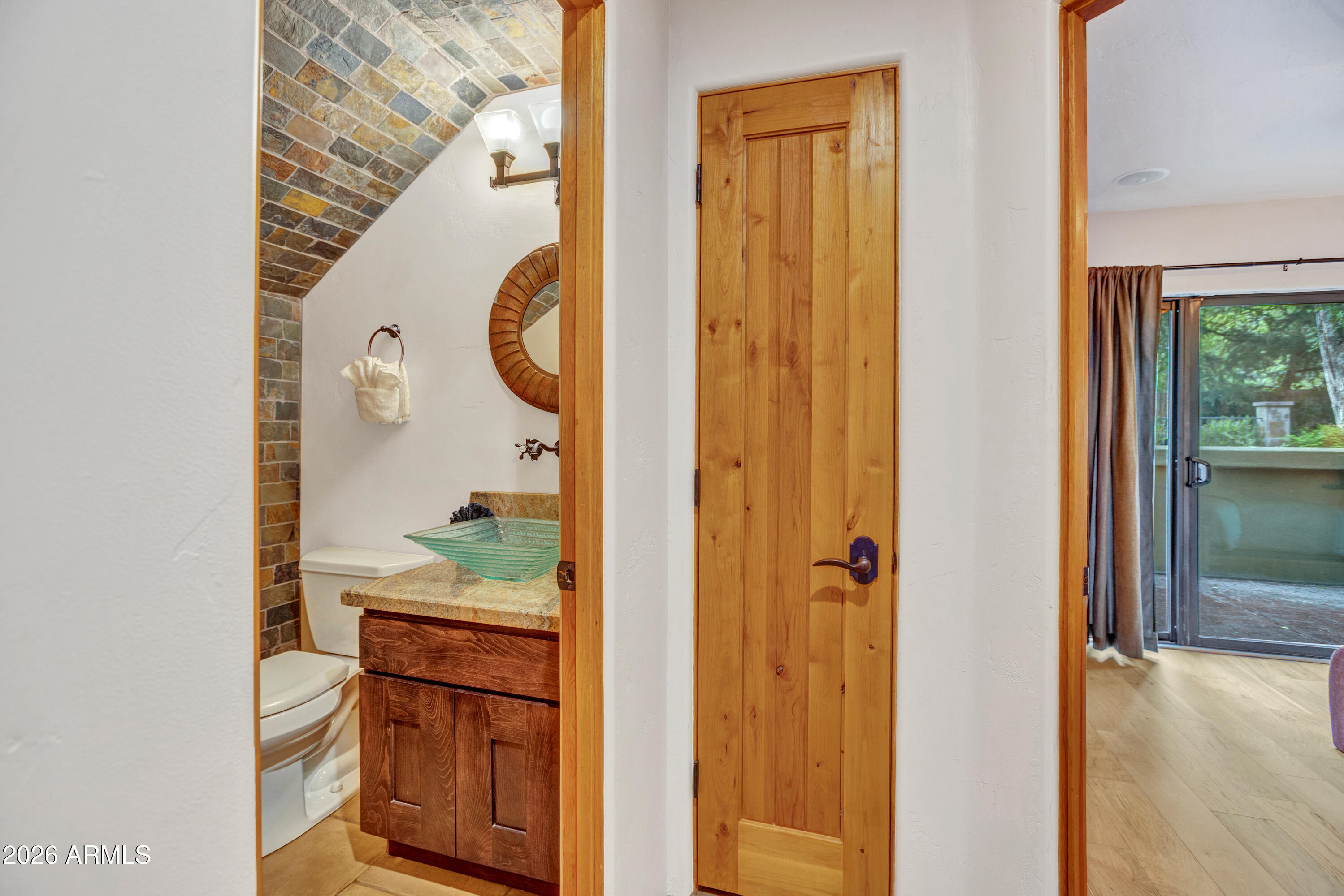 55 Ranch House Circle Sedona, AZ 86336 - Photo 27 of 61 a bathroom with a granite countertop sink and a mirror