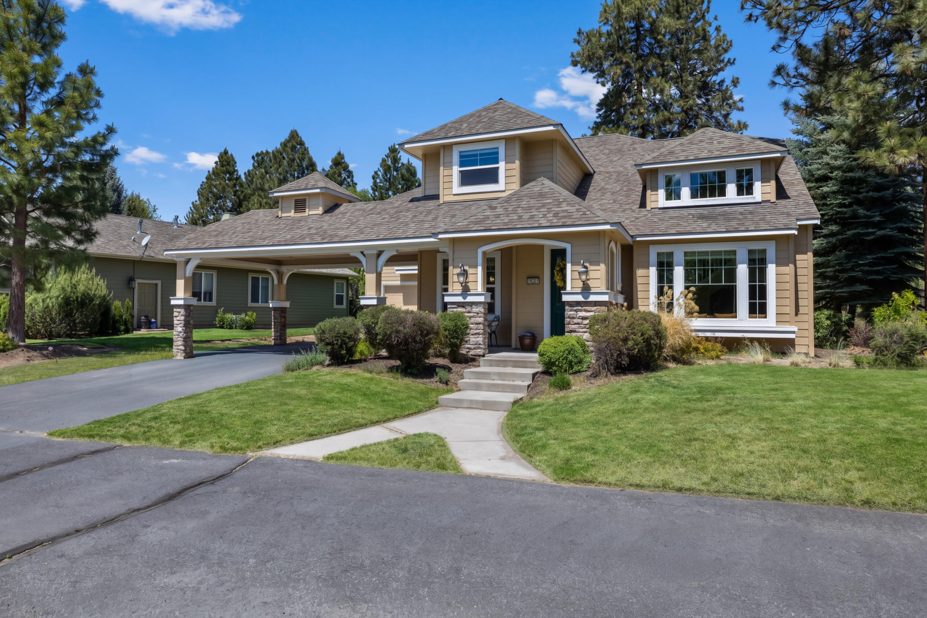 19307 Blue Lake Loop Bend, OR 97702 - Photo 2 of 58 a front view of a house with a yard