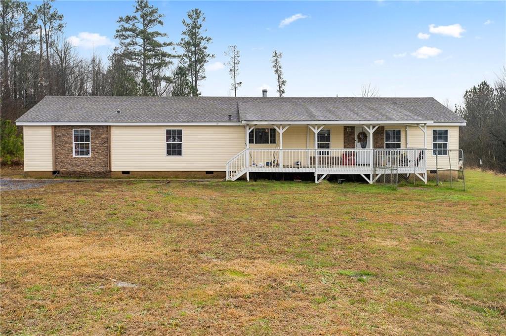 2488 Henry Gallman Road Resaca, GA 30735 - Photo 1 of 1 a view of a house with a garden and yard
