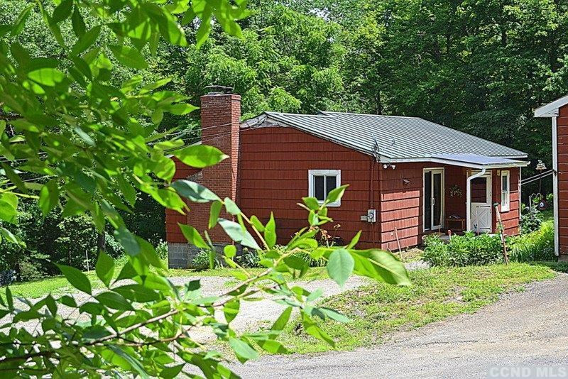 42 Decker Road Claverack, NY 12521 - Photo 1 of 10 a front view of a house with a garden