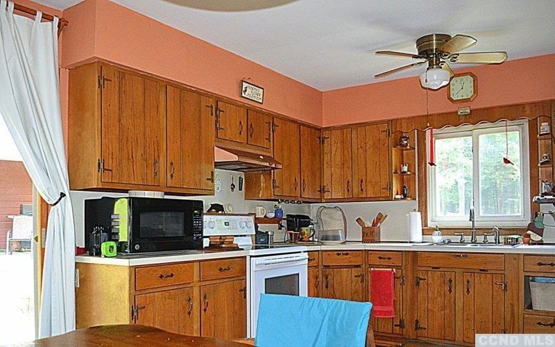 42 Decker Road Claverack, NY 12521 - Photo 3 of 10 a kitchen with stainless steel appliances granite countertop a sink a stove cabinets and a microwave