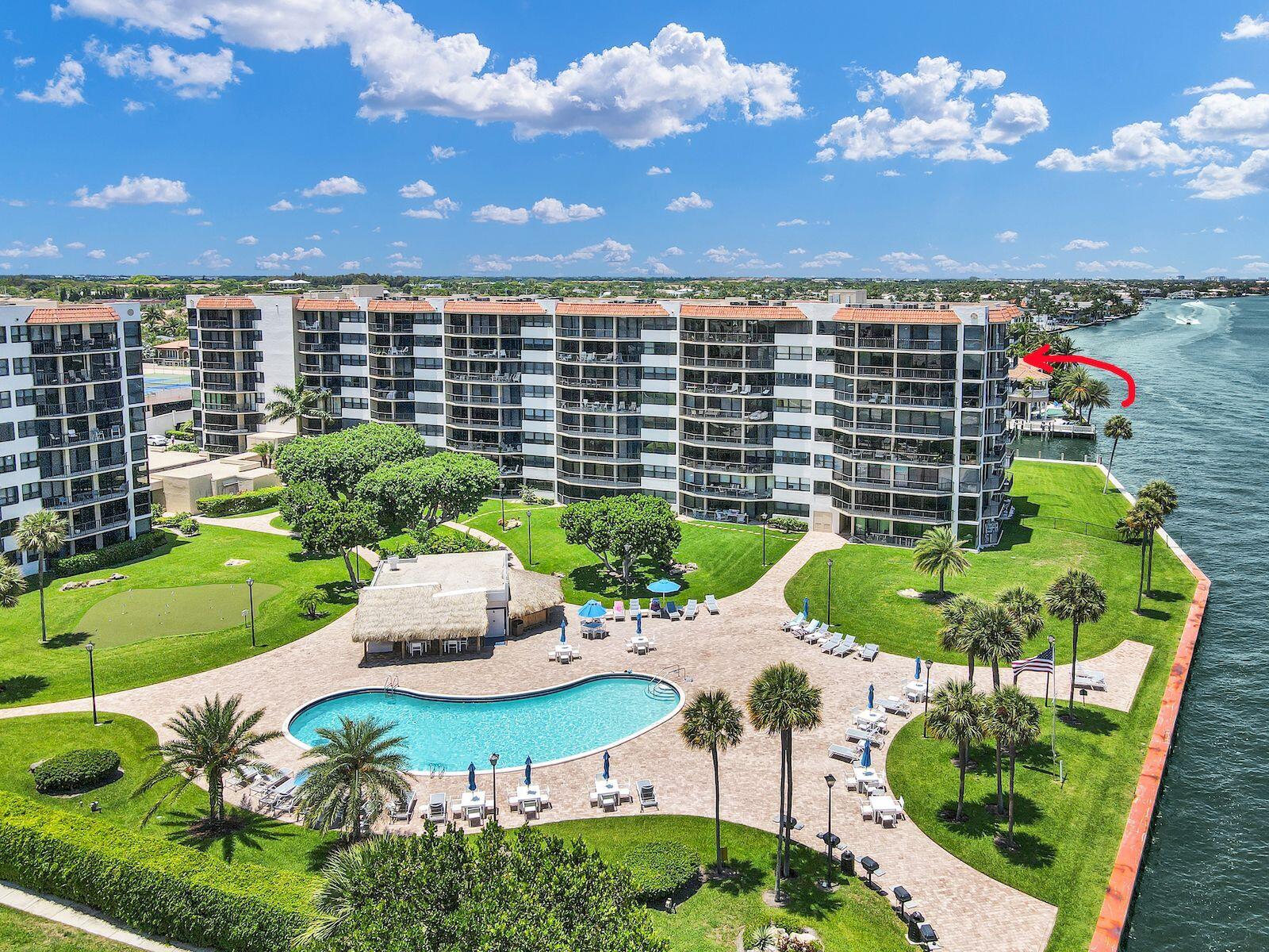 899 Jeffery Street, Unit 714 Boca Raton, FL 33487 - Photo 27 of 51 a view of a chairs and table in backyard