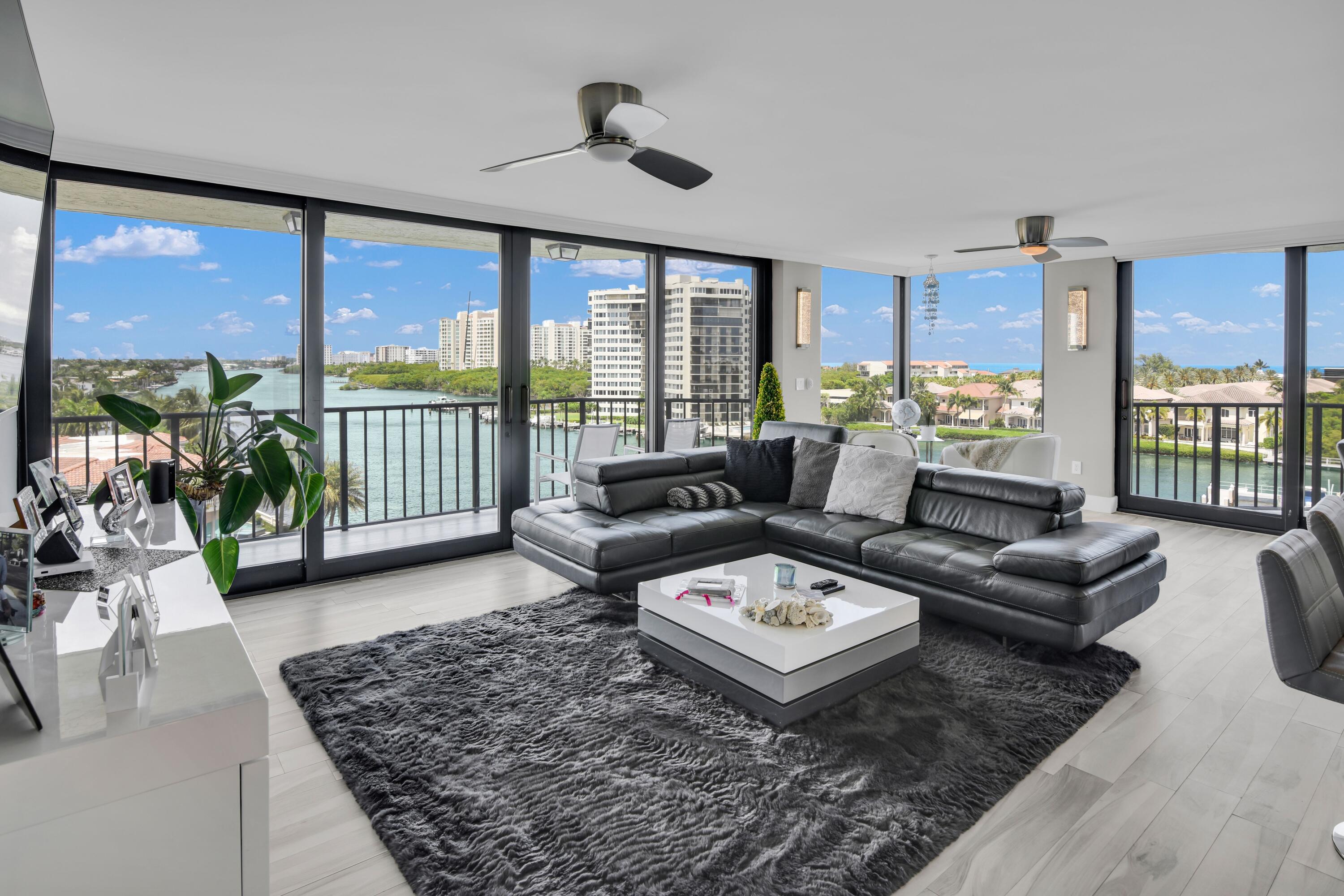 899 Jeffery Street, Unit 714 Boca Raton, FL 33487 - Photo 3 of 51 a living room with furniture floor to ceiling window and wooden floor