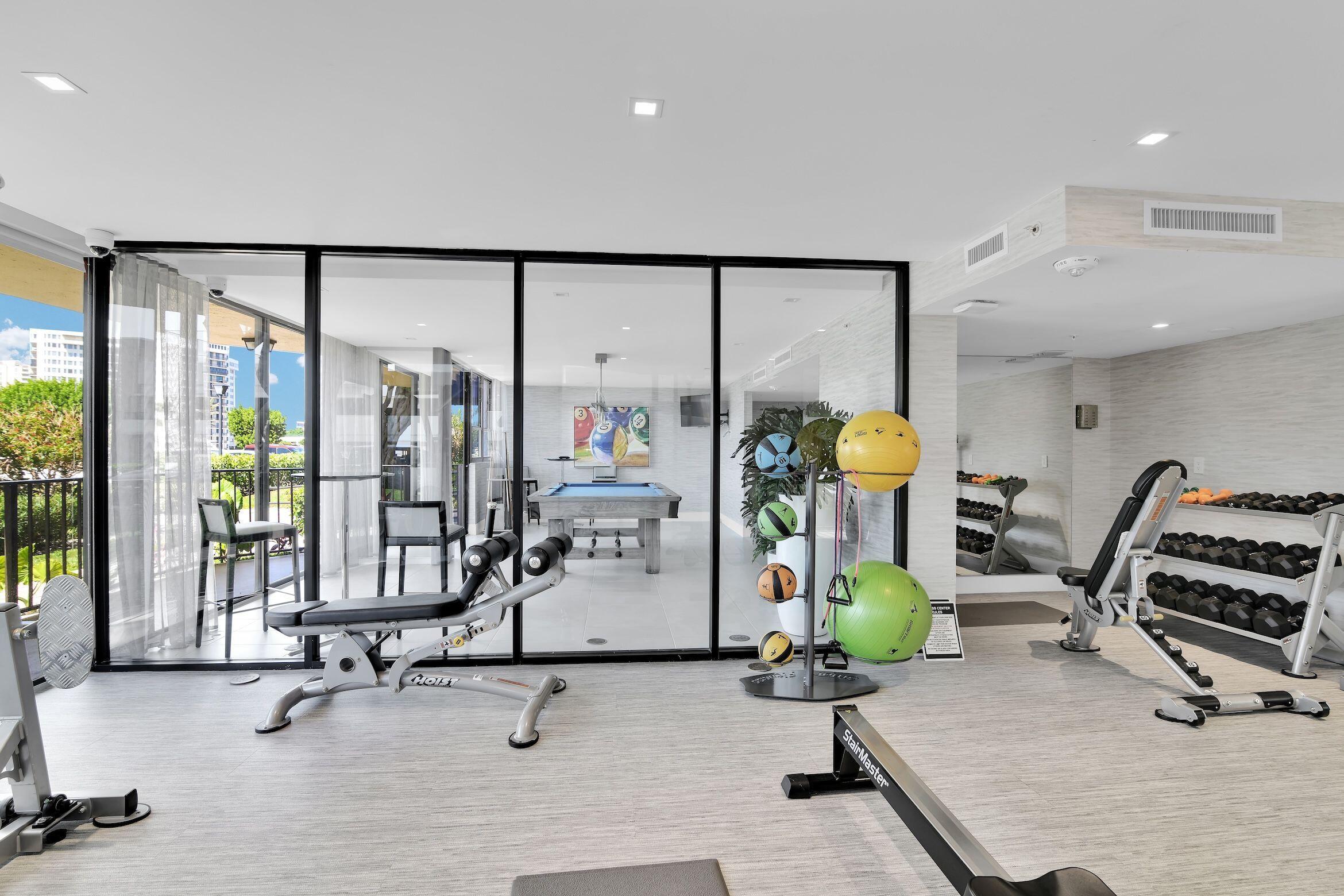 899 Jeffery Street, Unit 714 Boca Raton, FL 33487 - Photo 41 of 51 a view of a room with gym equipment