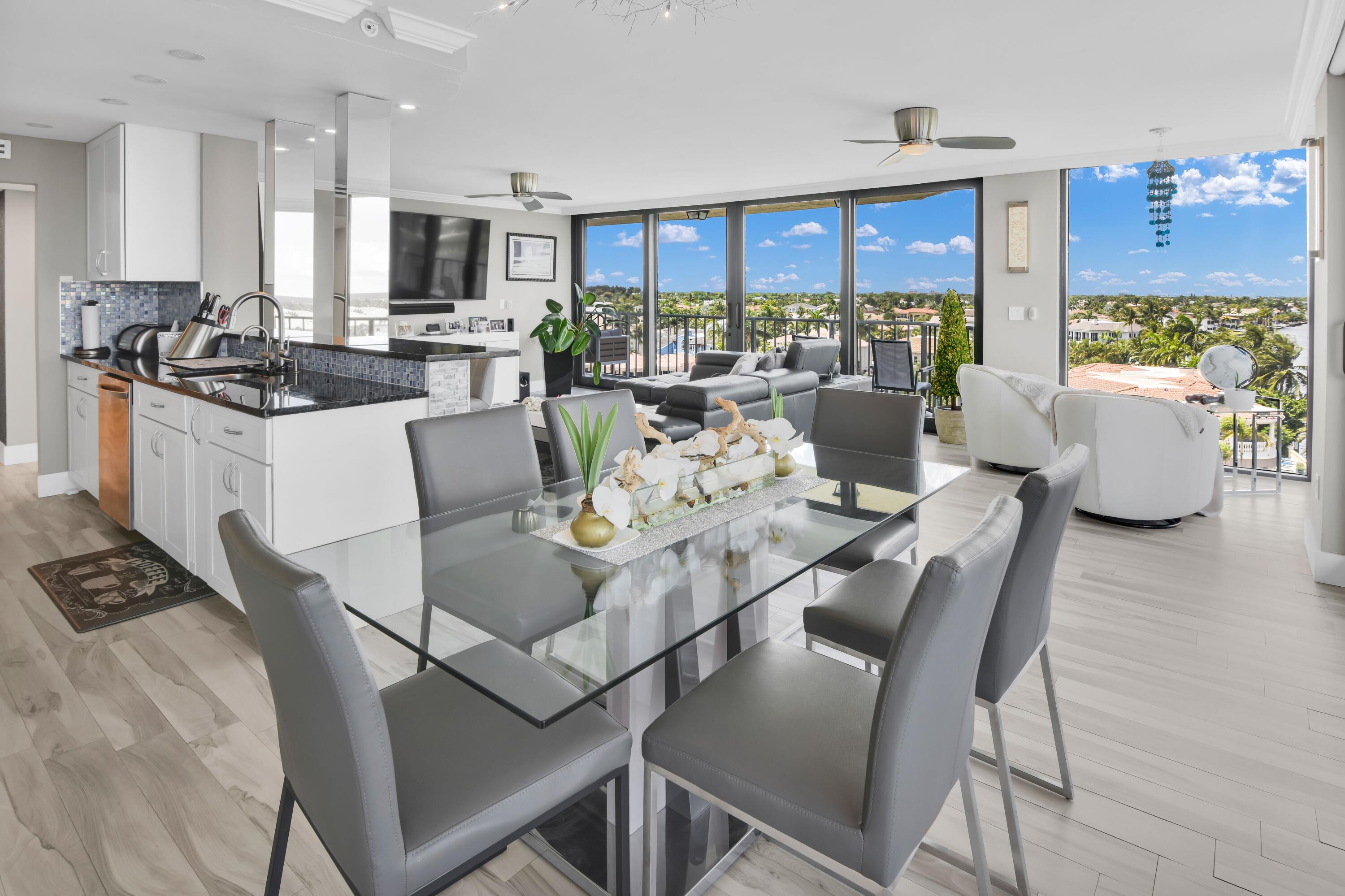 899 Jeffery Street, Unit 714 Boca Raton, FL 33487 - Photo 5 of 51 a living room with furniture and a flat screen tv
