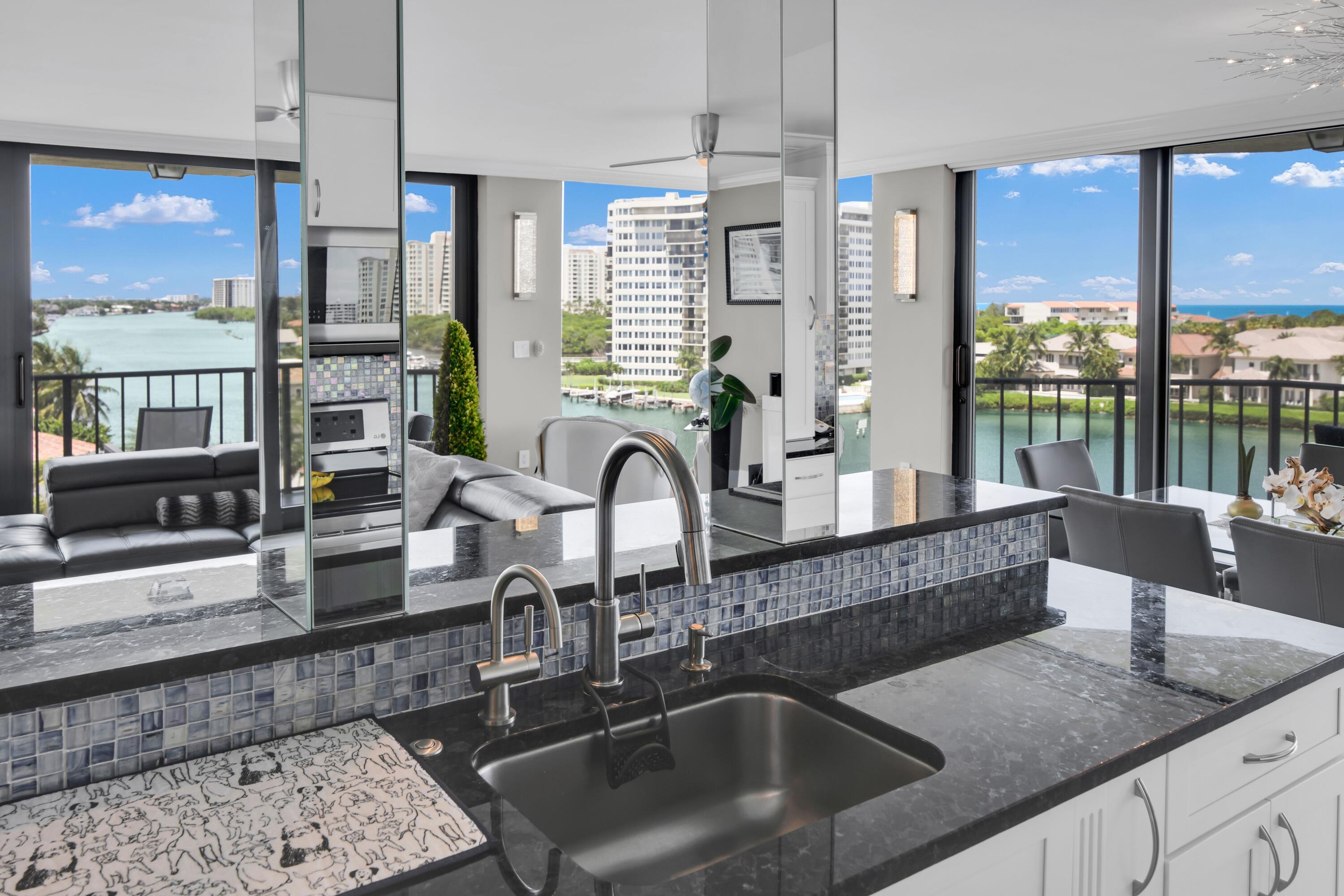 899 Jeffery Street, Unit 714 Boca Raton, FL 33487 - Photo 6 of 51 a kitchen with granite countertop a sink and a counter top space
