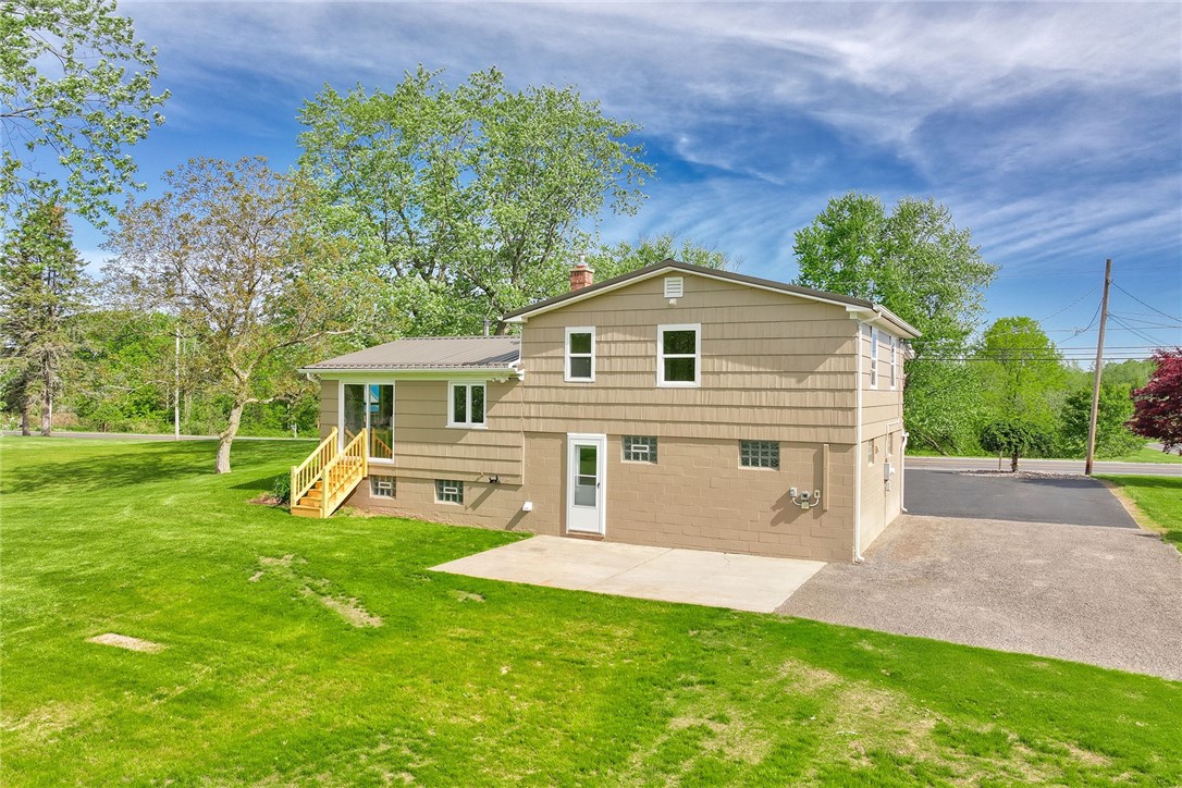 1815 Woodard Road Webster, NY 14580 - Photo 4 of 45 REAR EXTERIOR - PATIO - NEW PARKING AREA NEXT TO G