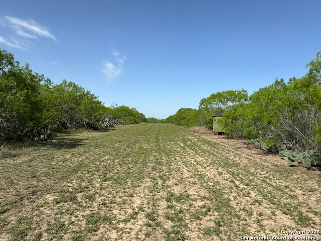 23 Windmill Ranchettes Cr 329 Pleasanton, TX 78064 - Photo 2 of 4 a view of a lake with mountains in the background