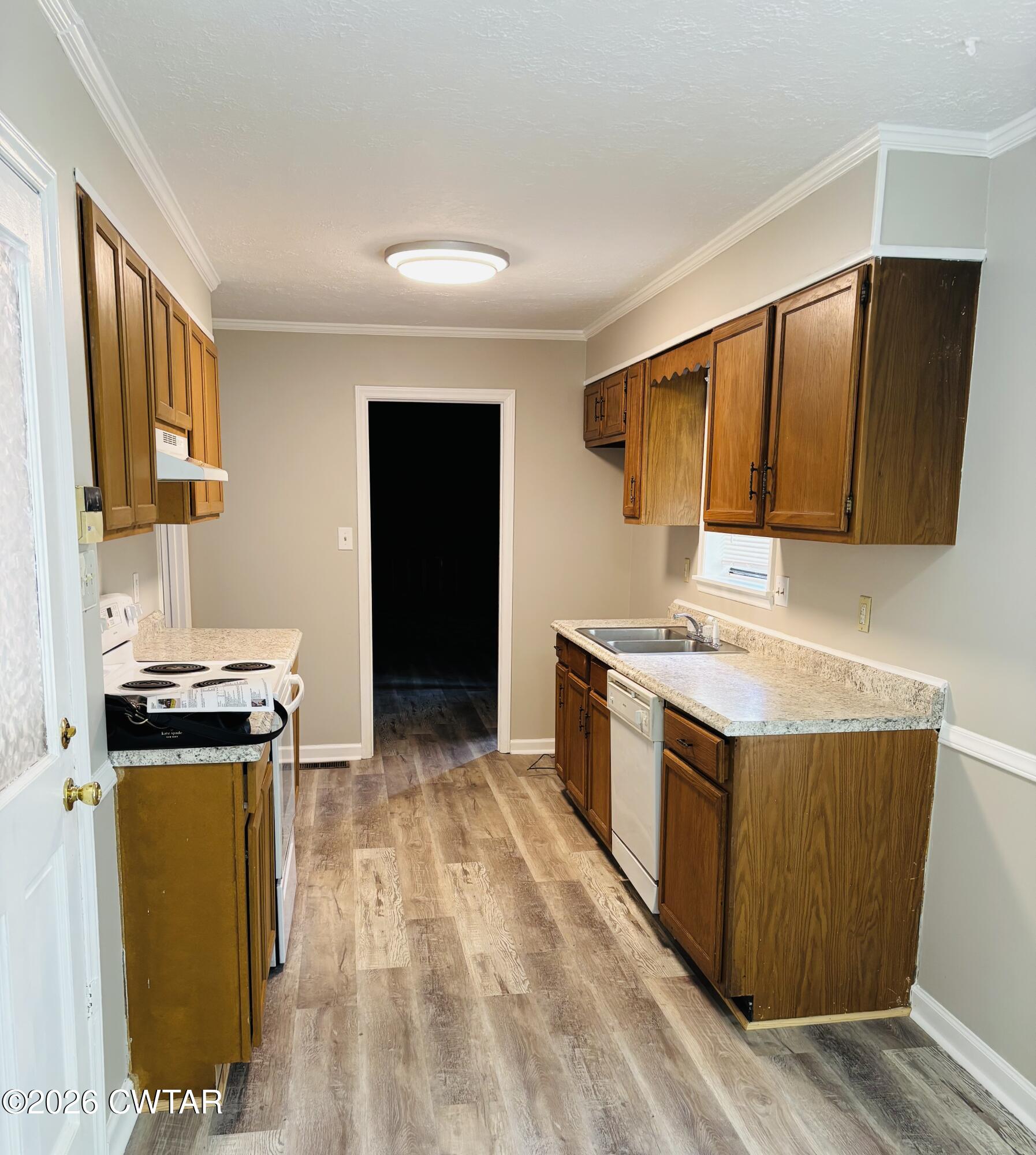149 Commanche Trail Jackson, TN 38305 - Photo 4 of 15 a kitchen with a stove top oven sink and cabinets