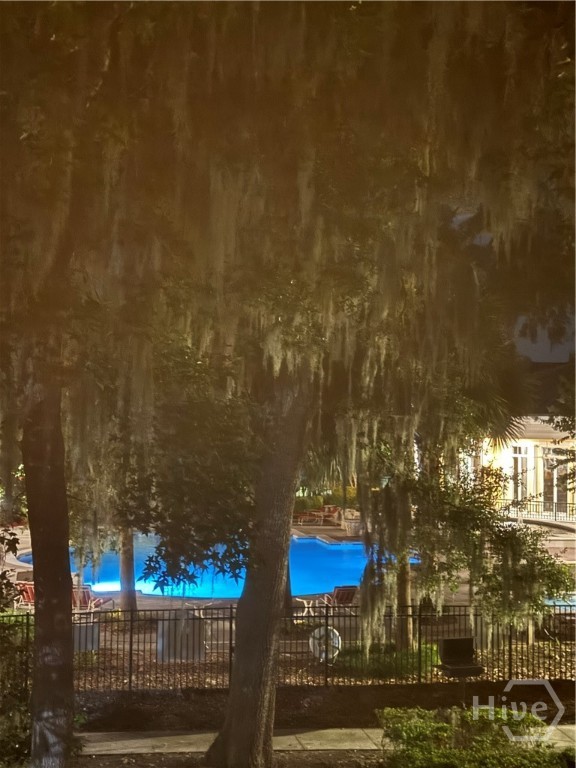 3027 Whitemarsh Way Savannah, GA 31410 - Photo 8 of 30 Night view of the pool from the condo