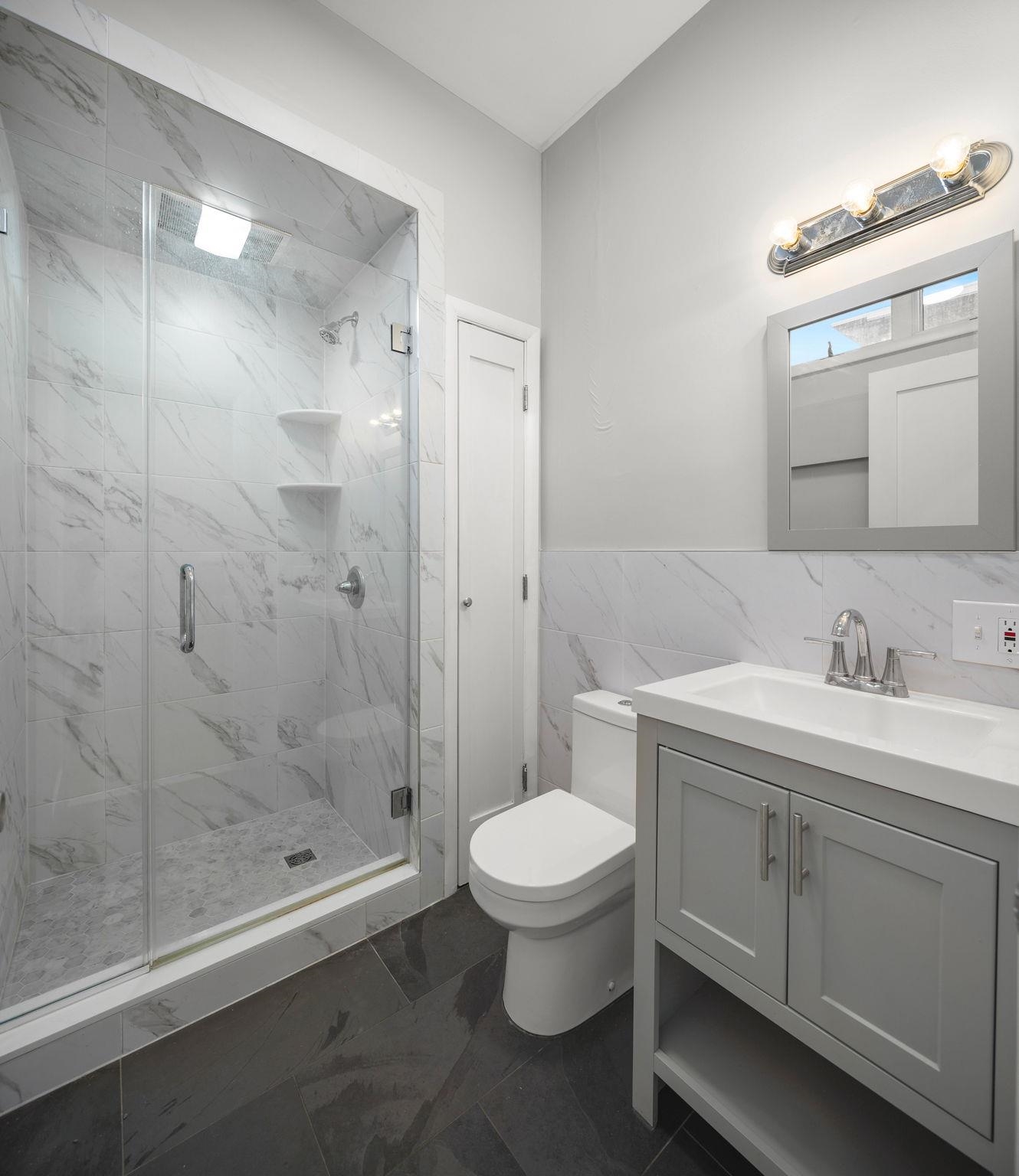 431 7th Street, Unit 2B Union City, NJ 07087 - Photo 12 of 16 a bathroom with a sink toilet and shower
