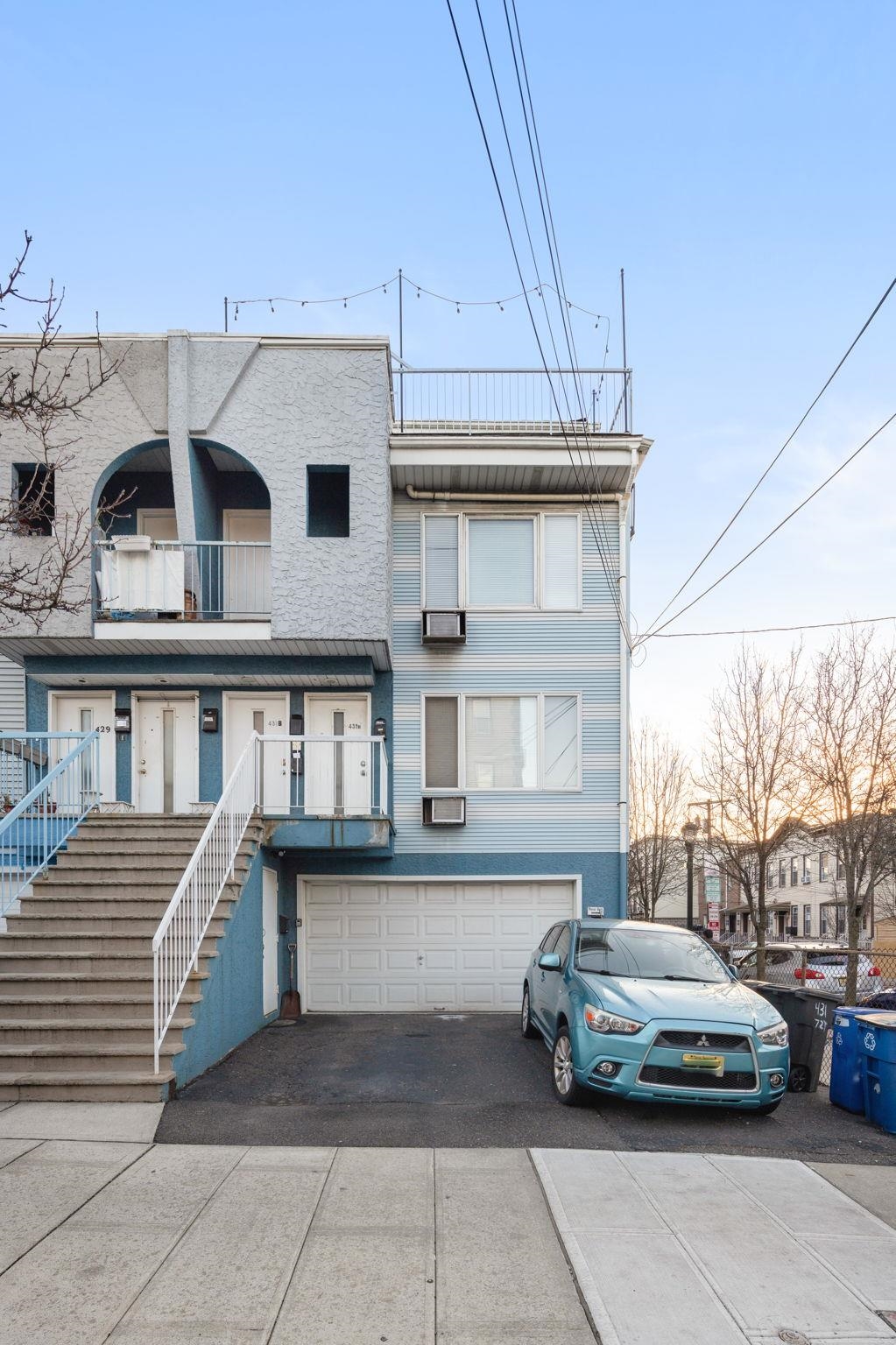 431 7th Street, Unit 2B Union City, NJ 07087 - Photo 13 of 16 a car parked in front of a white building