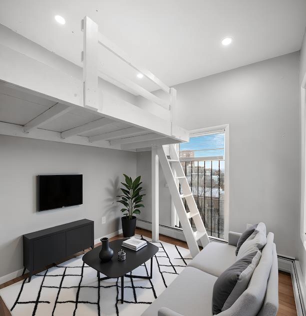 431 7th Street, Unit 2B Union City, NJ 07087 - Photo 10 of 16 a living room with furniture and a flat screen tv