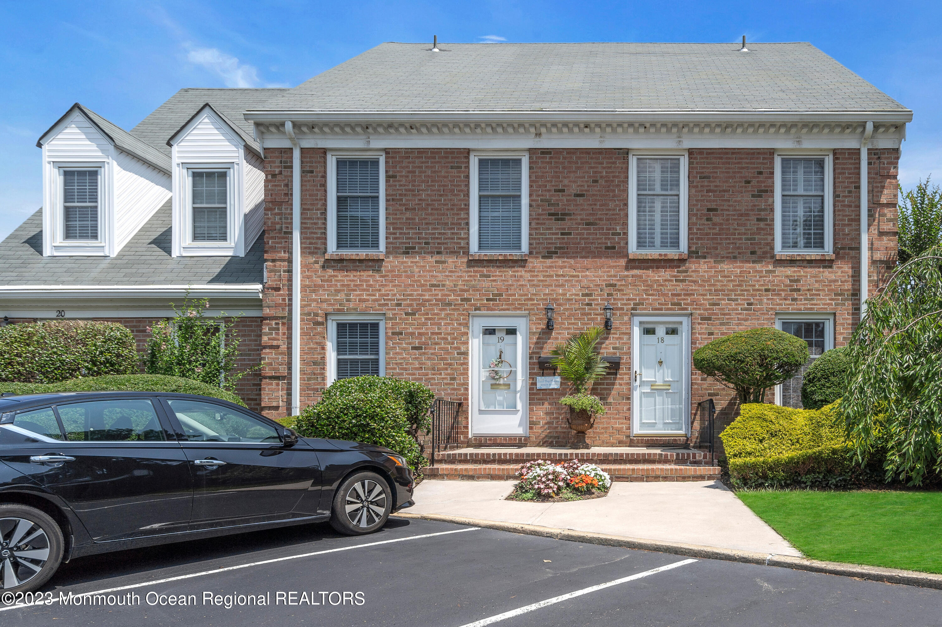 18 Wyckham Road Spring Lake Heights, NJ 07762 - Photo 2 of 74 a front view of a house with a garden