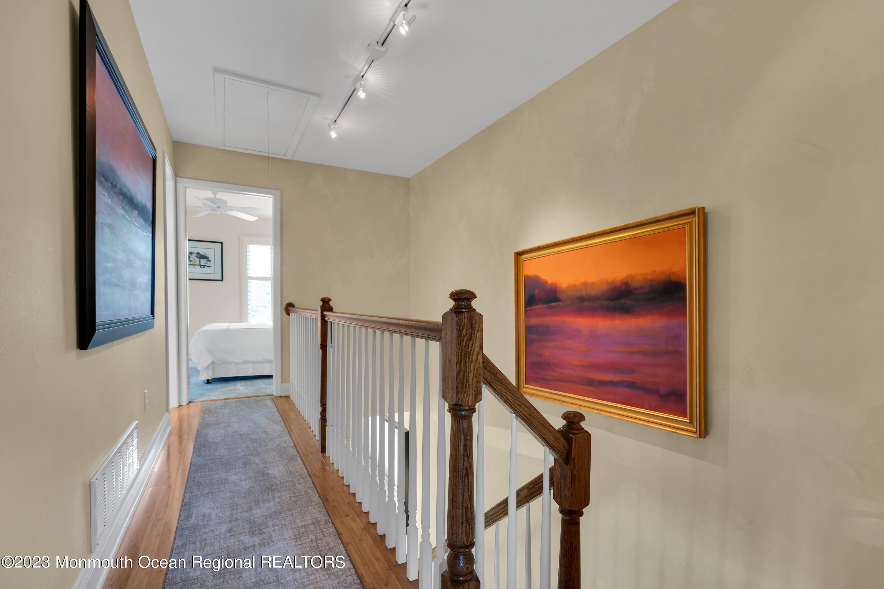 18 Wyckham Road Spring Lake Heights, NJ 07762 - Photo 28 of 74 a view of a hallway with wooden floor and stairs