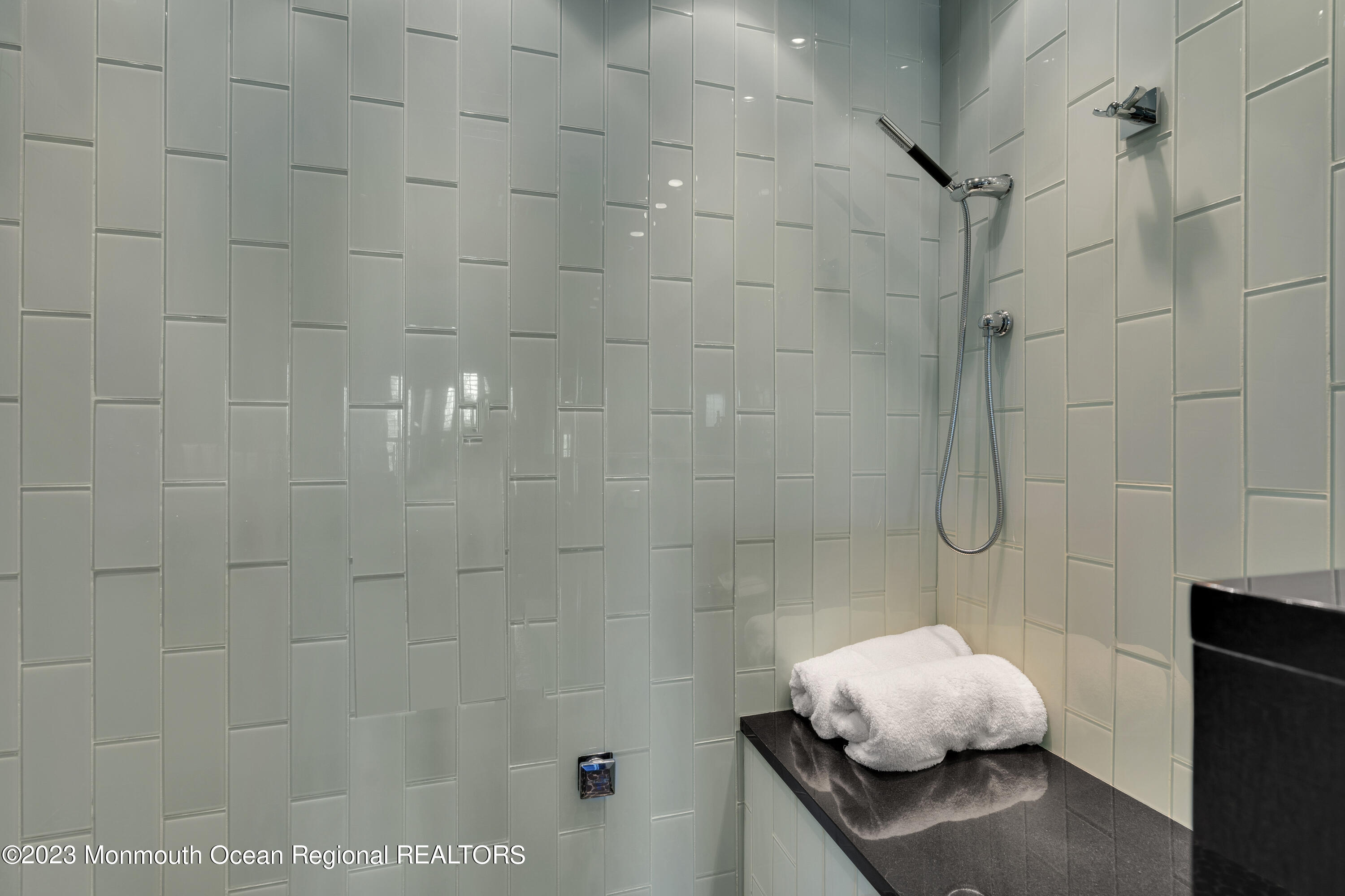 18 Wyckham Road Spring Lake Heights, NJ 07762 - Photo 41 of 74 a bathroom with a granite countertop shower and a sink