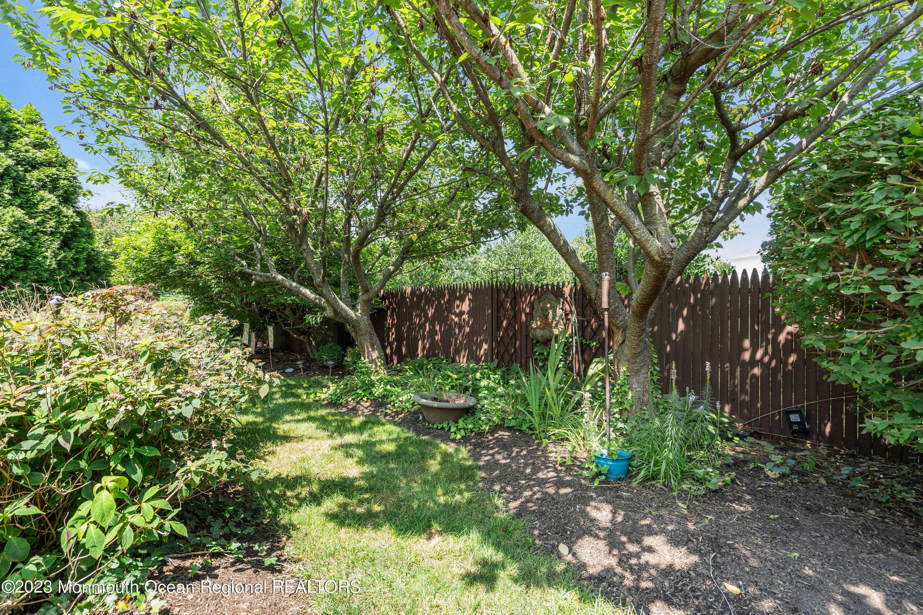 18 Wyckham Road Spring Lake Heights, NJ 07762 - Photo 65 of 74 a backyard of a house with lots of green space