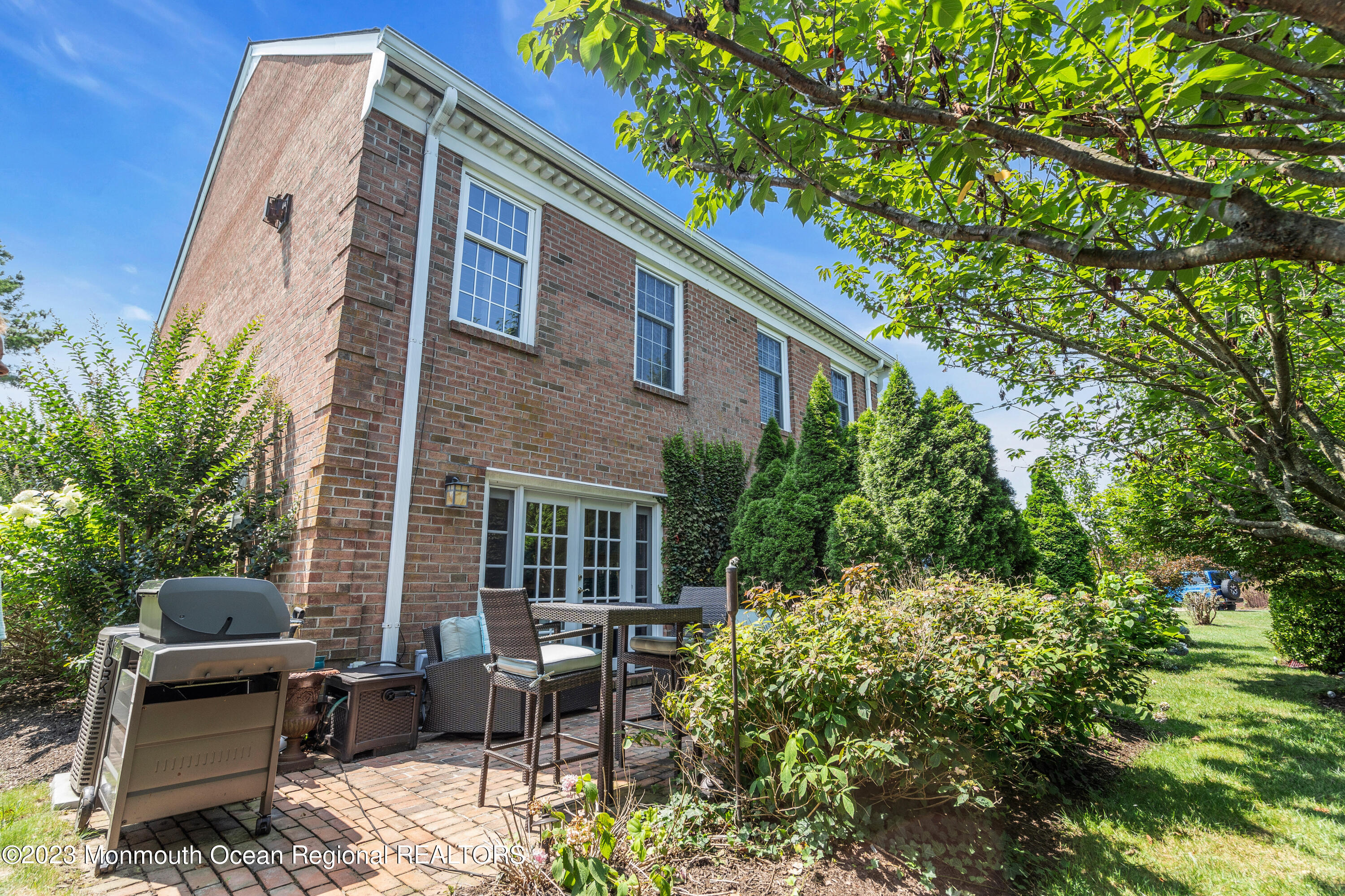 18 Wyckham Road Spring Lake Heights, NJ 07762 - Photo 67 of 74 a backyard of a house with seating space