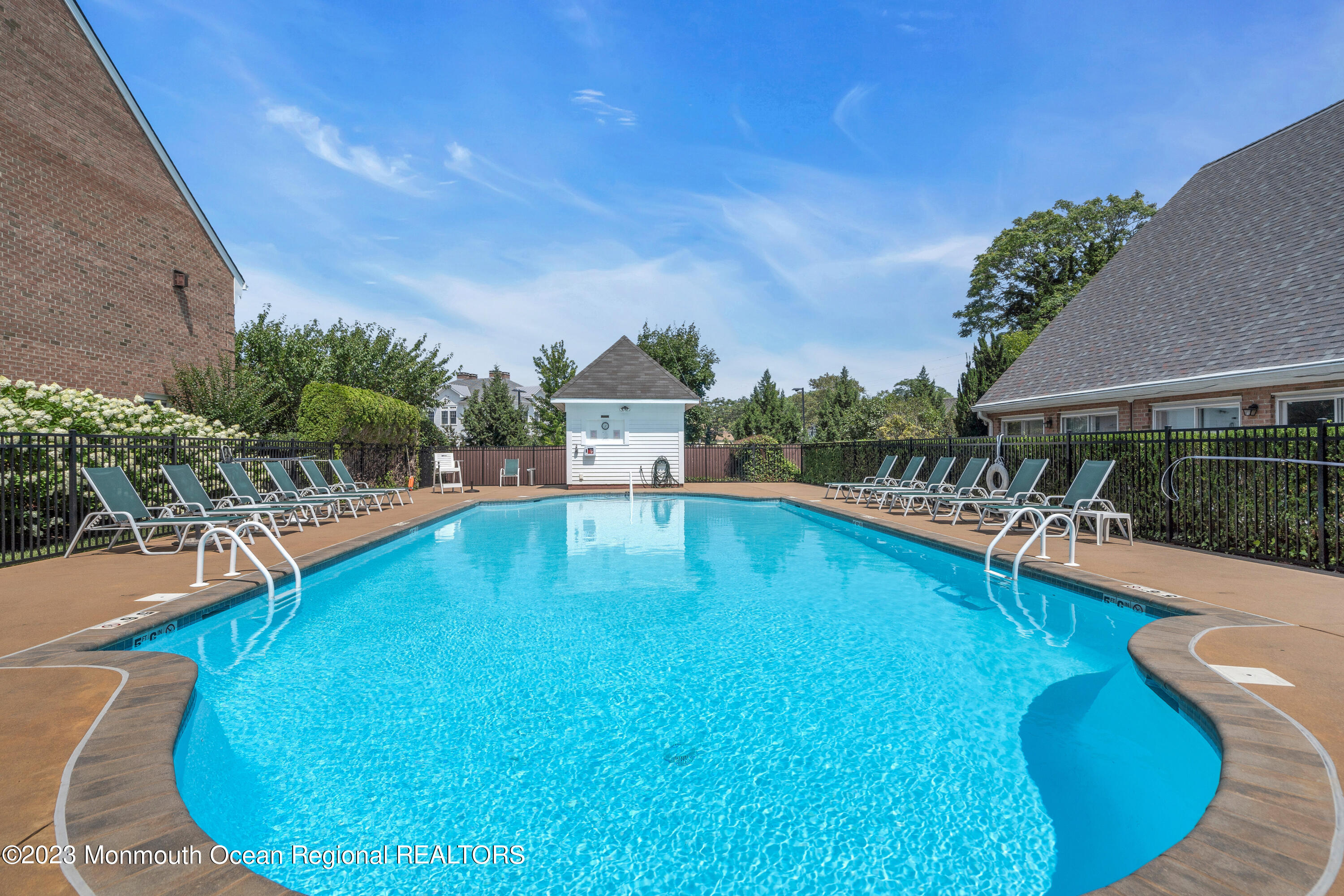 18 Wyckham Road Spring Lake Heights, NJ 07762 - Photo 72 of 74 a swimming pool with outdoor seating and yard