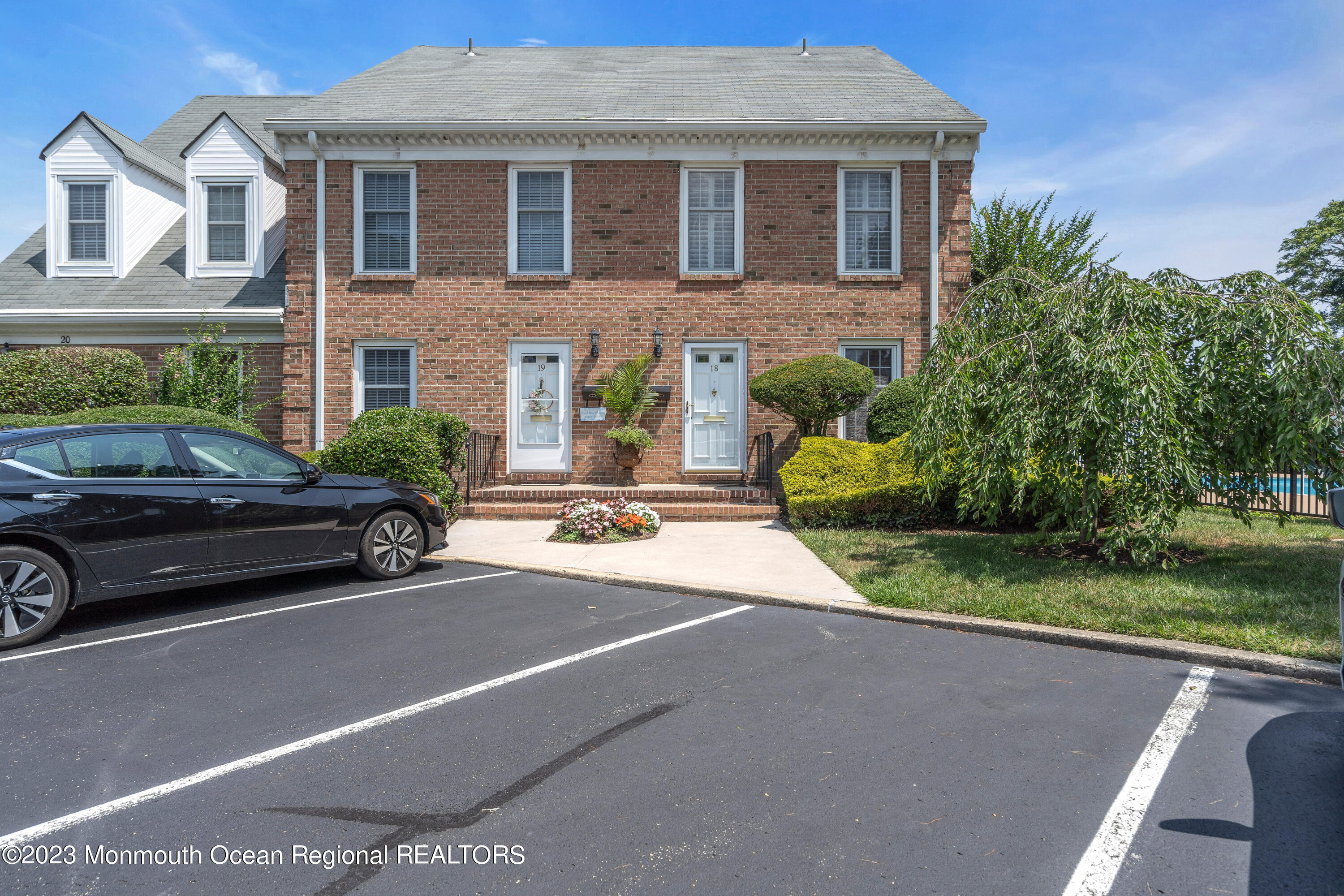18 Wyckham Road Spring Lake Heights, NJ 07762 - Photo 73 of 74 a view of a car parked in front of a brick house