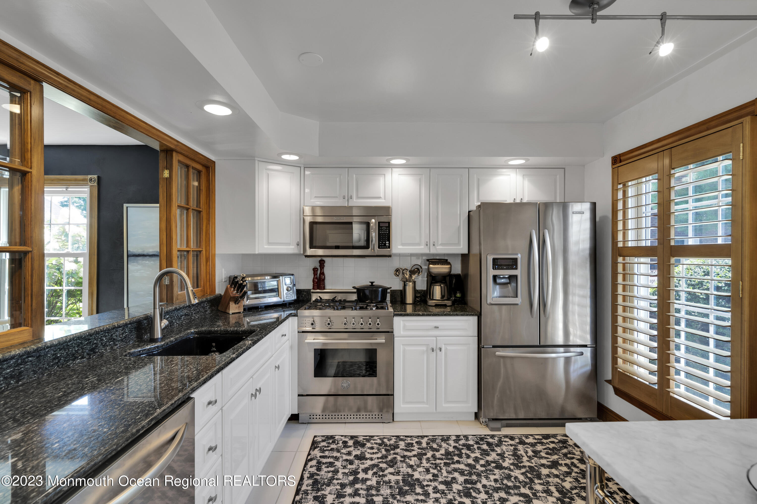 18 Wyckham Road Spring Lake Heights, NJ 07762 - Photo 8 of 74 a kitchen with stainless steel appliances a refrigerator sink and stove