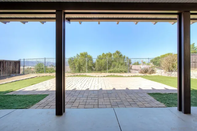 a view of balcony with yard