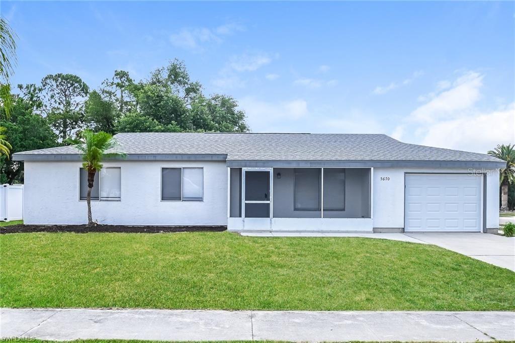 5670 Postma Street North Port, FL 34287 - Photo 1 of 1 a front view of a house with a garden and yard