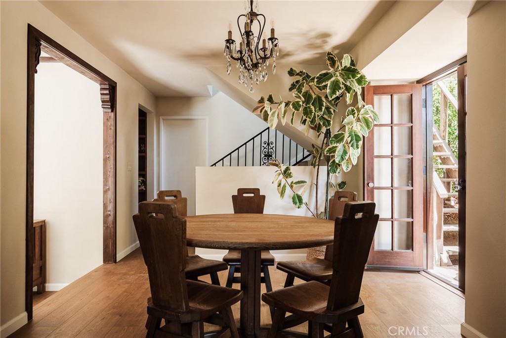 718 Sunnyhill Drive Los Angeles, CA 90065 - Photo 13 of 28 a view of a dining room with furniture window and wooden floor