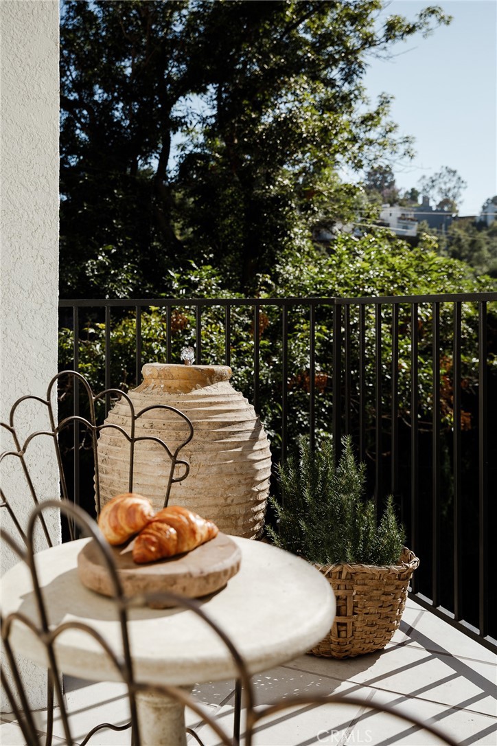 718 Sunnyhill Drive Los Angeles, CA 90065 - Photo 17 of 28 a view of a chairs and table in patio