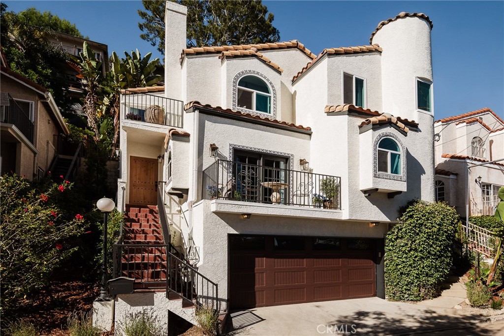 718 Sunnyhill Drive Los Angeles, CA 90065 - Photo 2 of 28 a front view of a house with a yard