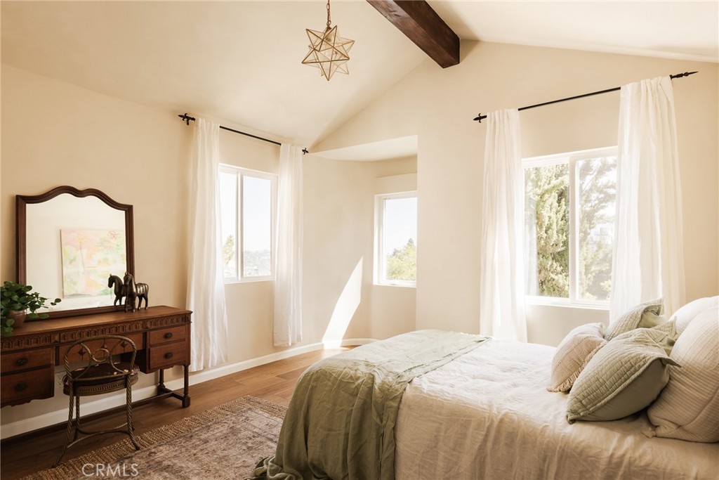 718 Sunnyhill Drive Los Angeles, CA 90065 - Photo 21 of 28 a bedroom with a bed and a window