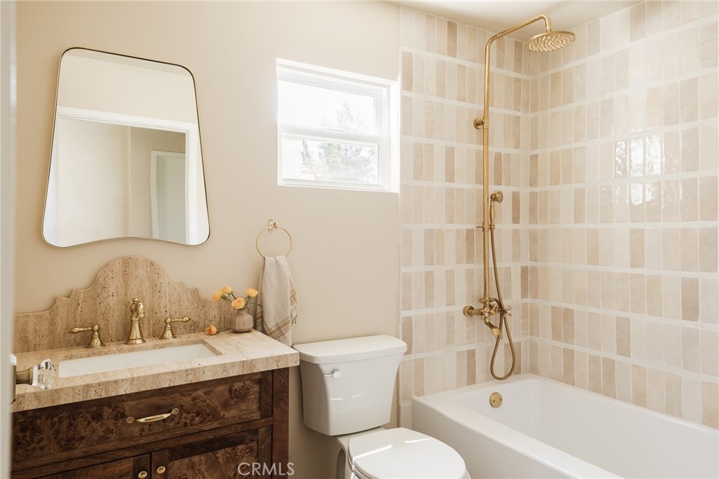 718 Sunnyhill Drive Los Angeles, CA 90065 - Photo 23 of 28 a bathroom with a sink a toilet and shower
