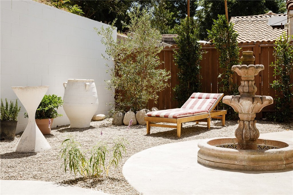 718 Sunnyhill Drive Los Angeles, CA 90065 - Photo 27 of 28 a view of a bench in the backyard