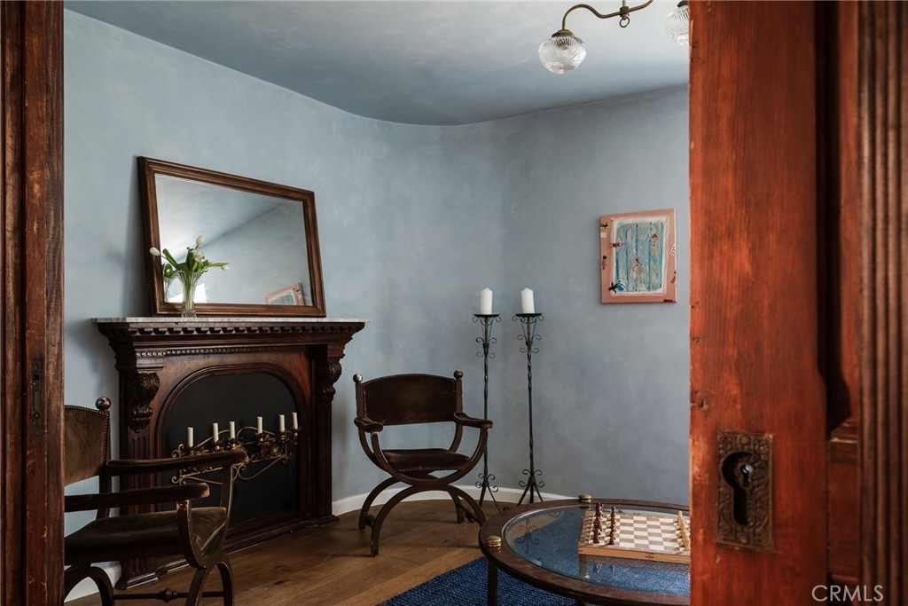 718 Sunnyhill Drive Los Angeles, CA 90065 - Photo 8 of 28 a living room with furniture and a fireplace