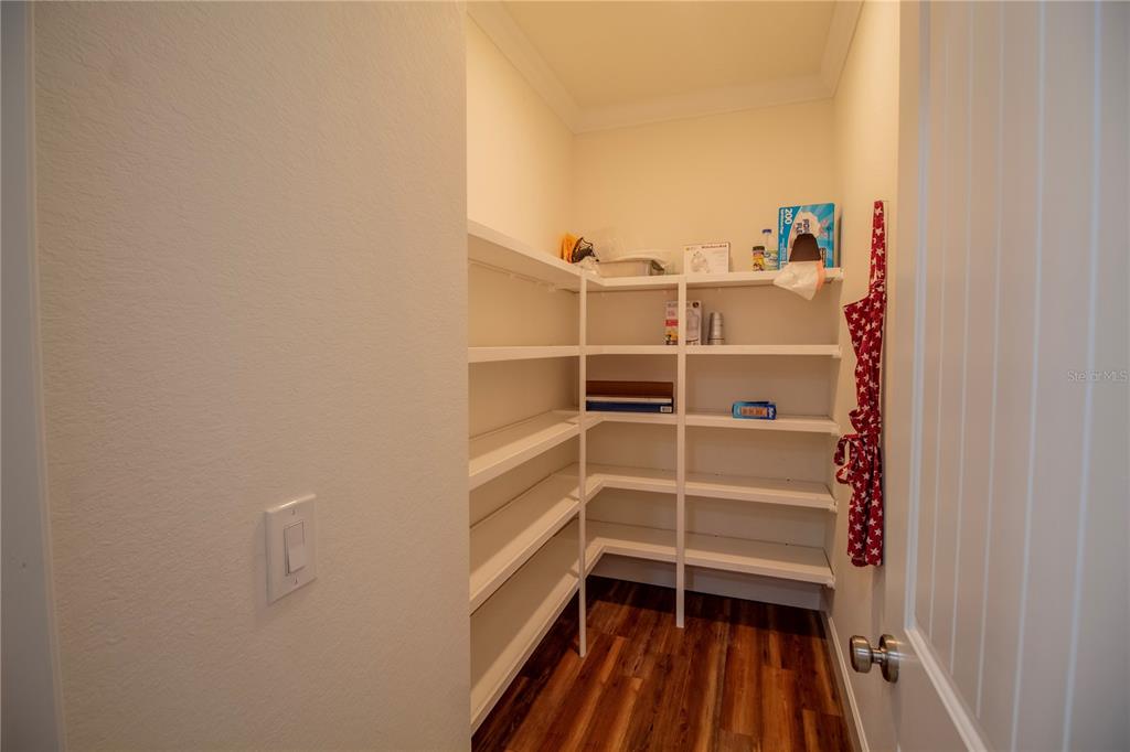 14056 Hydrangea Avenue Port Charlotte, FL 33953 - Photo 18 of 73 a view of walk in closet with empty racks