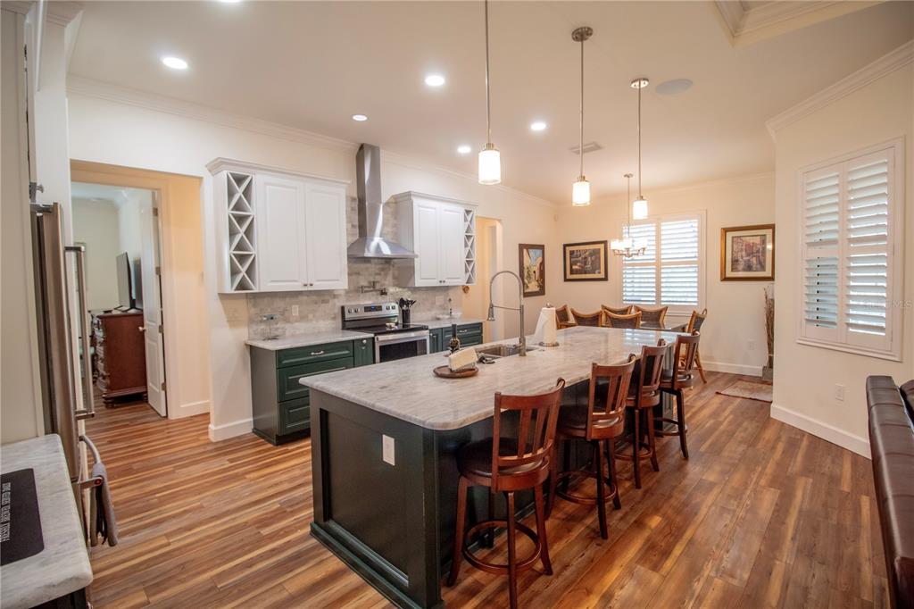 14056 Hydrangea Avenue Port Charlotte, FL 33953 - Photo 7 of 73 a large kitchen with a table and chairs