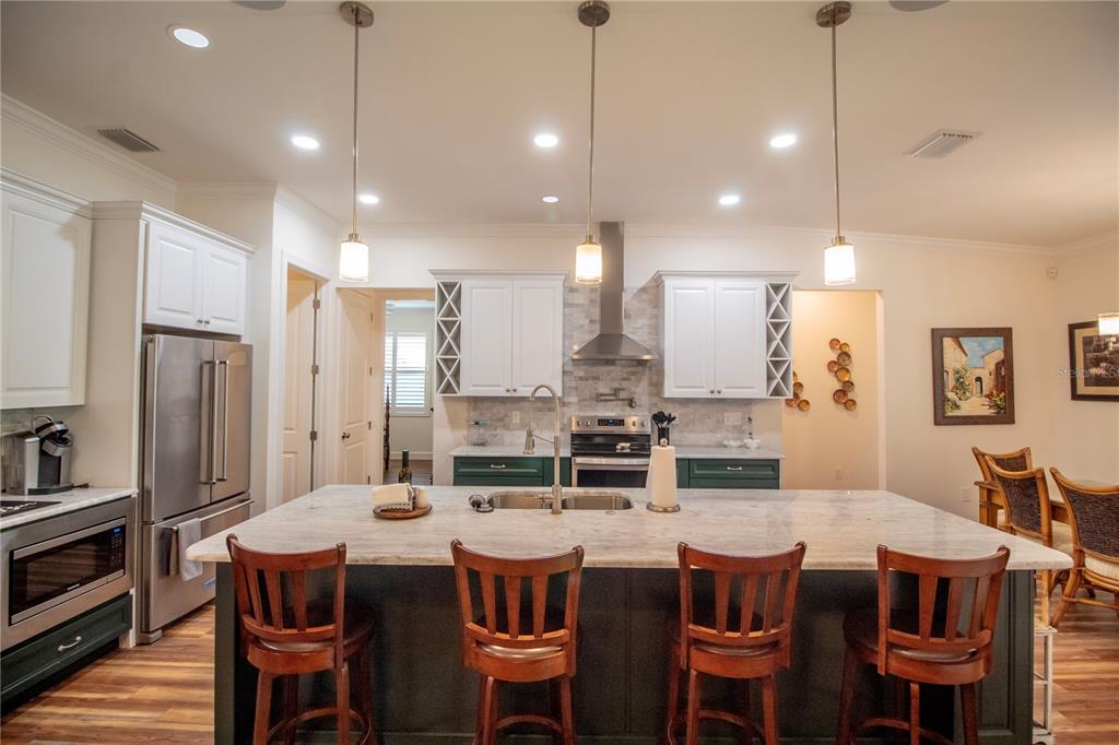 14056 Hydrangea Avenue Port Charlotte, FL 33953 - Photo 8 of 73 a large kitchen with a table and chairs