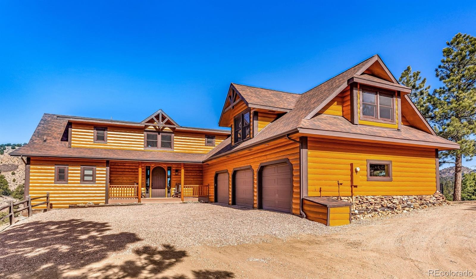 400 Ridge Road Westcliffe, CO 81252 - Photo 1 of 37 a front view of a house with a yard
