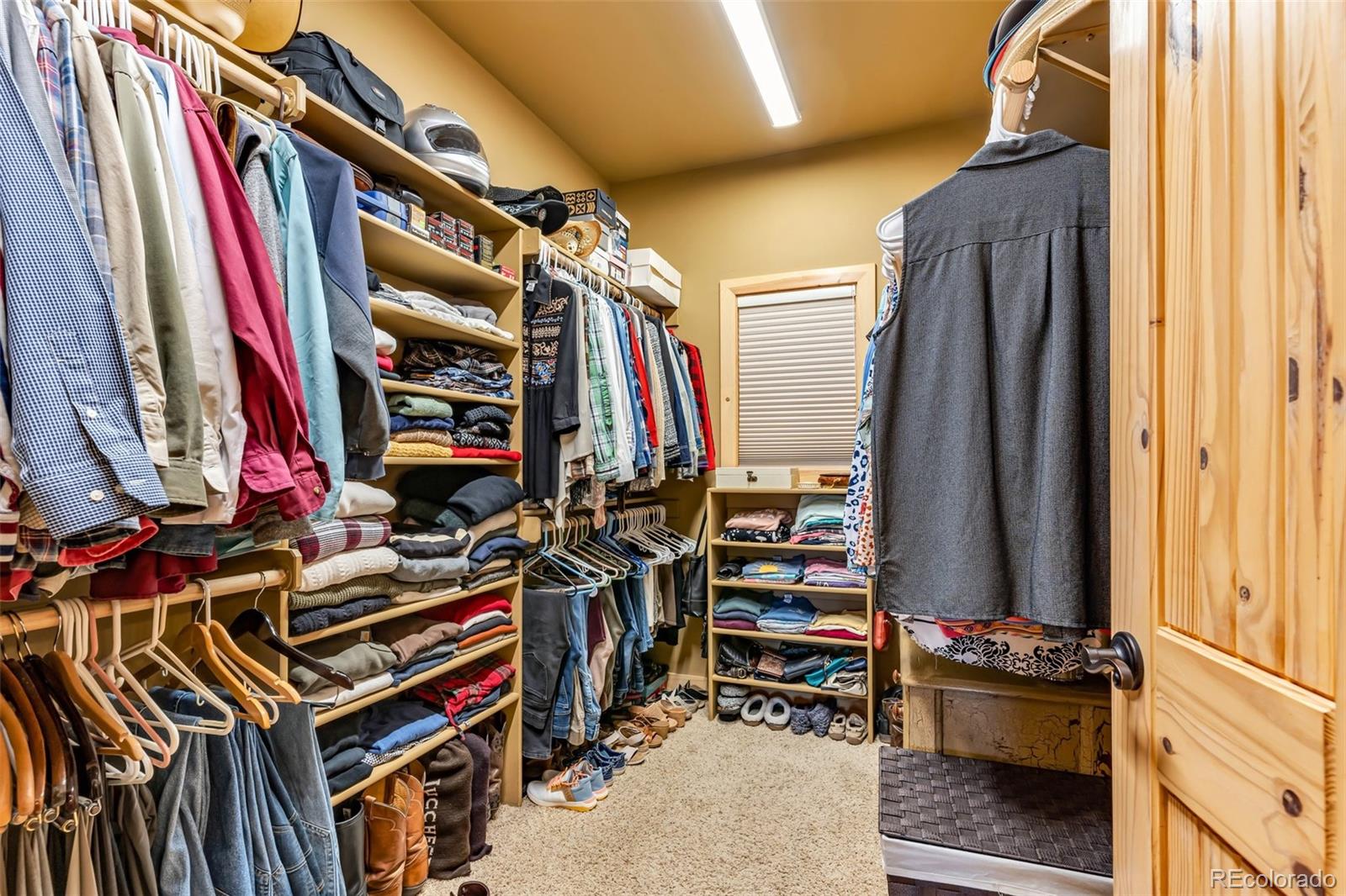 400 Ridge Road Westcliffe, CO 81252 - Photo 15 of 37 a view of walk in closet with clothes and shoes