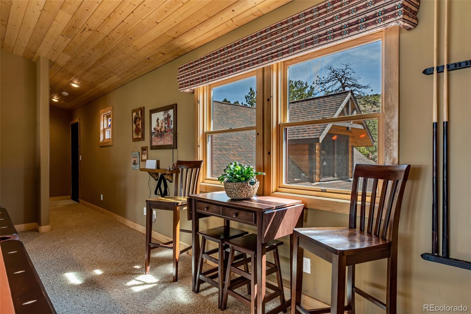 400 Ridge Road Westcliffe, CO 81252 - Photo 19 of 37 a view of a dining room with furniture and window