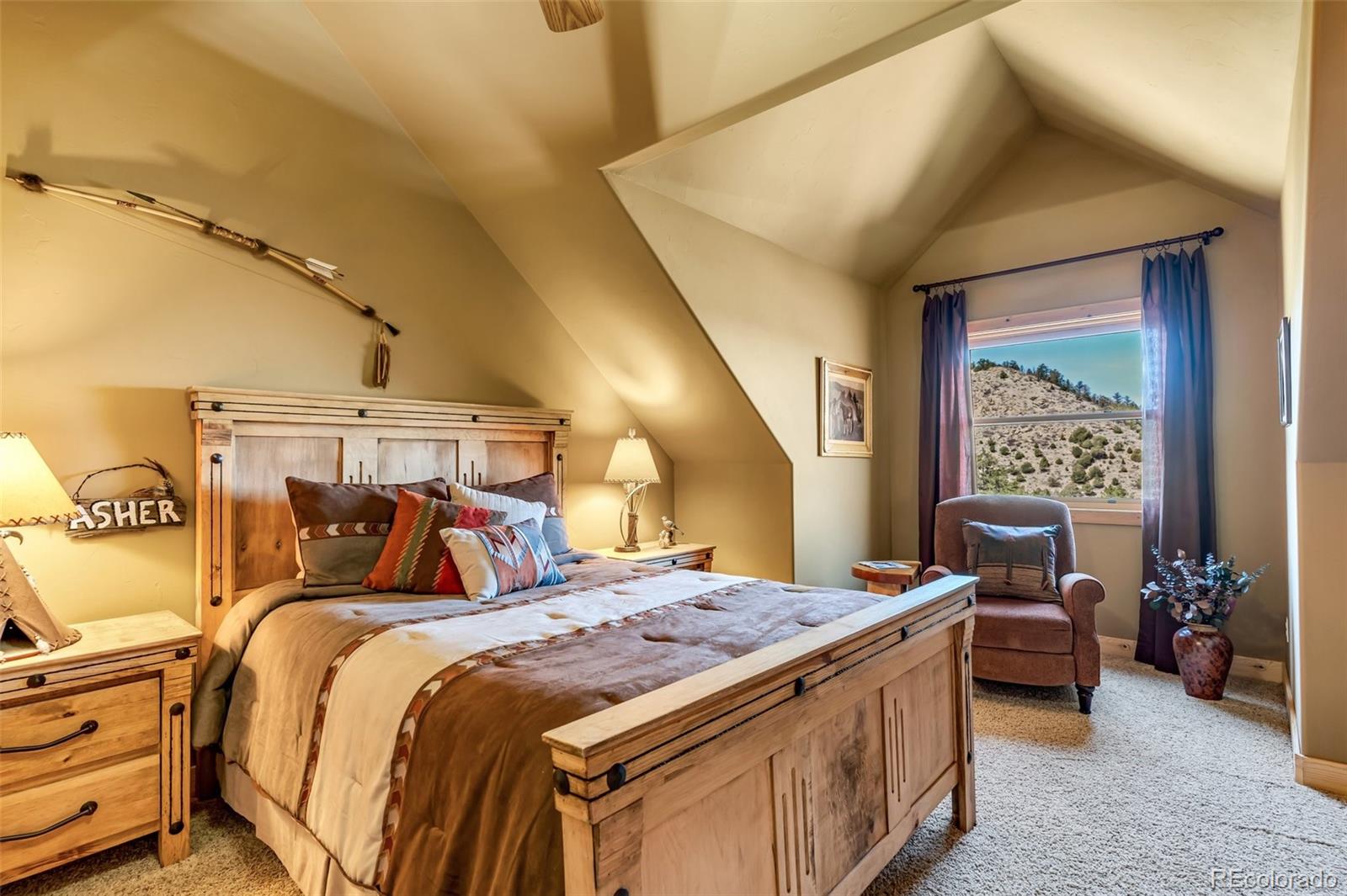 400 Ridge Road Westcliffe, CO 81252 - Photo 20 of 37 a bed room with a bed and a chair