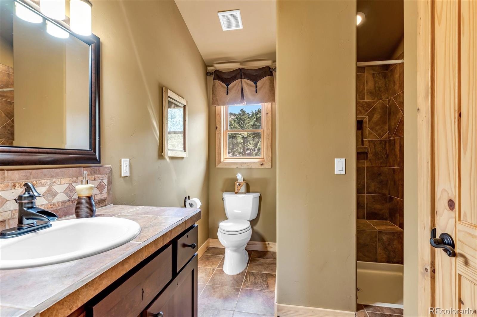 400 Ridge Road Westcliffe, CO 81252 - Photo 21 of 37 a bathroom with a sink and a mirror